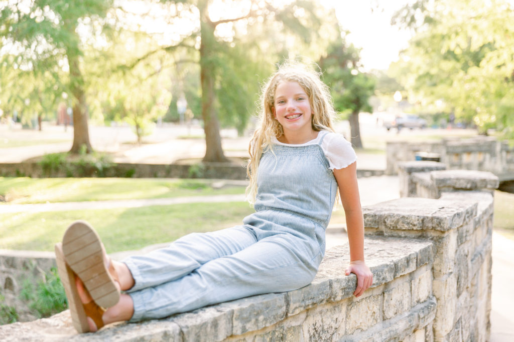 funny face by a lake in the mountains by San Antonio family photographer Sara Welburn
